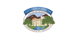 Flag of the City of San Marcos, California, featuring a seal with the text "CITY OF SAN MARCOS VALLEY OF DISCOVERY" and an illustration of a building, trees, and mountains.