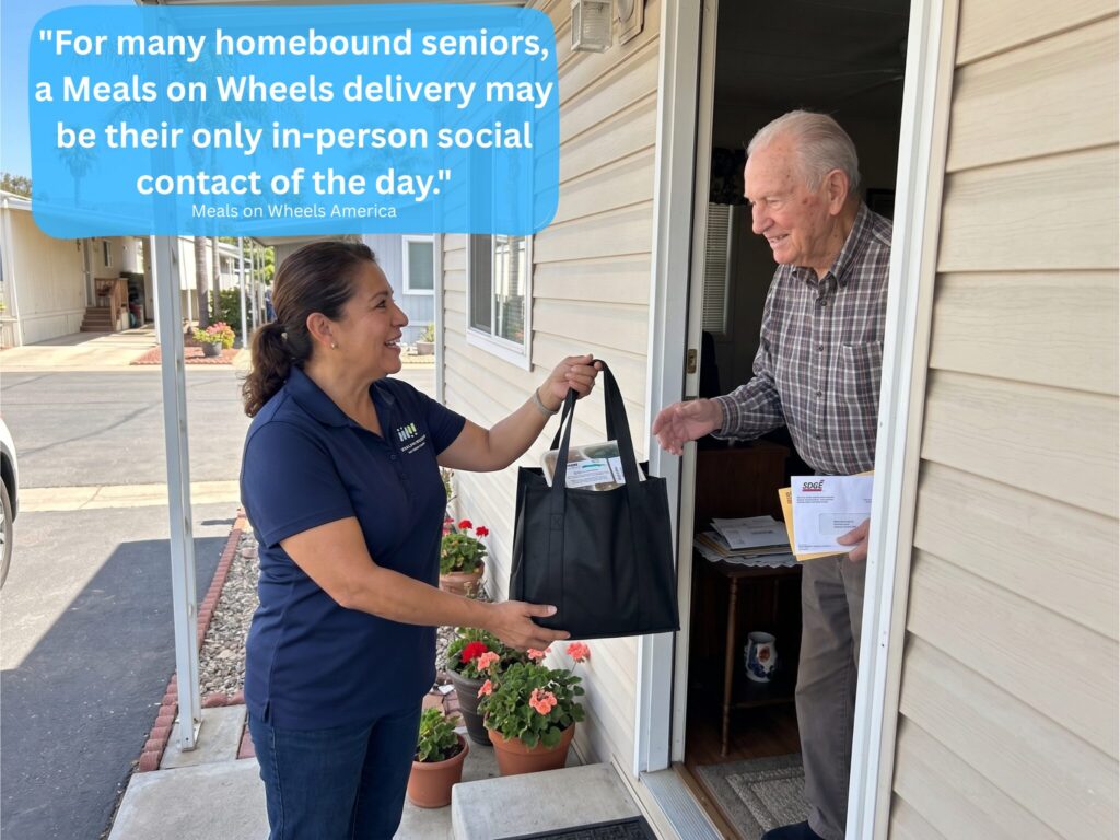 A Meals on Wheels volunteer hands a bag of food to a senior man at his doorway. Text overlay reads: "For many homebound seniors, a Meals on Wheels delivery may be their only in-person social contact of the day.